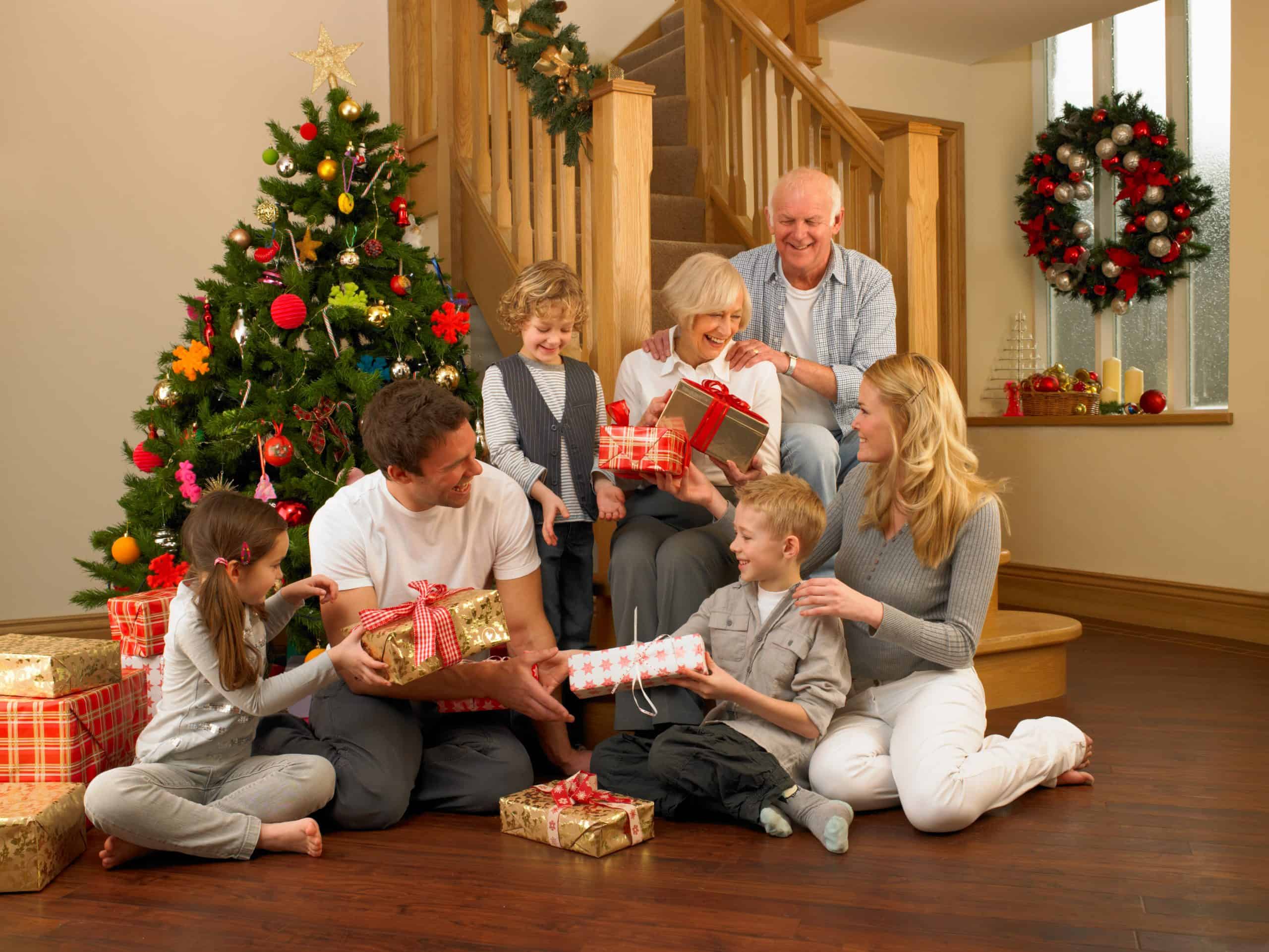 Family at Christmas on staircase   shutterstock  81748240